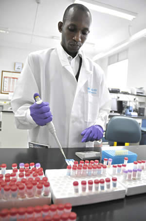 A laboratory technician at an HIV/AIDS institute in Uganda