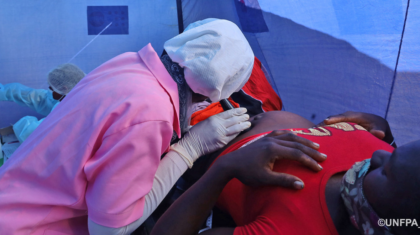 A nurse examining a pregnant woman at a UNFPA clinic in Madagascar