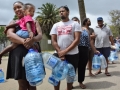Cape Town residents queue to fill containers with water. Photo: AP Photo/Bram Janssen