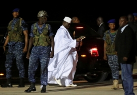 The Gambia’s former president Yahya Jammeh (in white) prepares to depart from Banjul airport to exile in Guinea Bissau on January 21, 2017. Photo: Reuters/Thierry Gouegnon