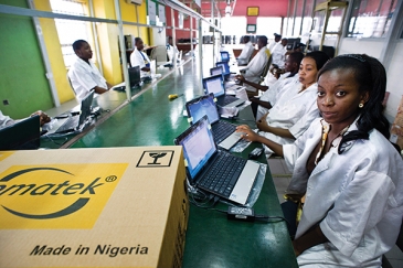 Technicians assemble computers at the Omatek factory in Lagos, Nigeria. Photo: Panos/Sven Torfinn