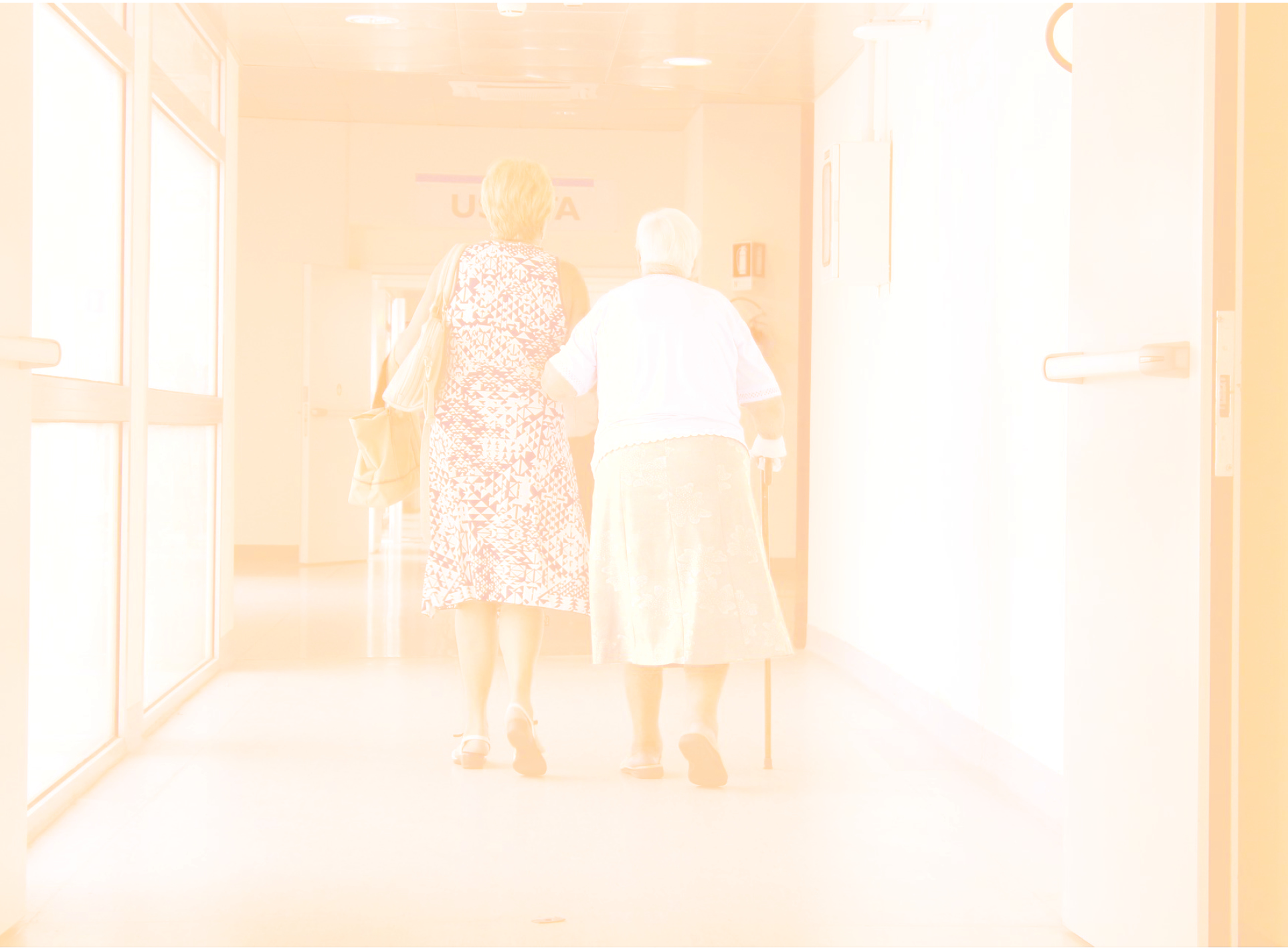 Photo with nurse helping older person in a care facility
