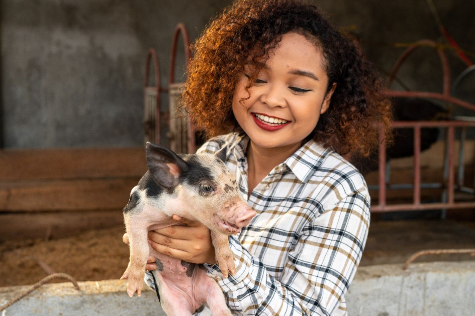 woman with piglet