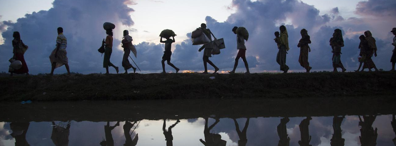 refugees walking with their belongings